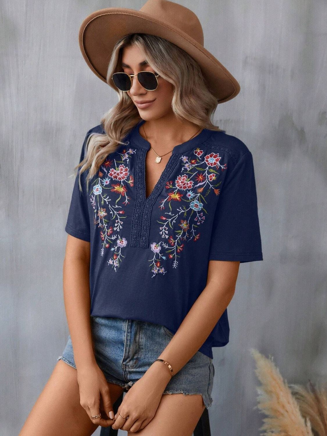 Dark Navy V-neck tee with colorful floral embroidery and crochet trim detail.