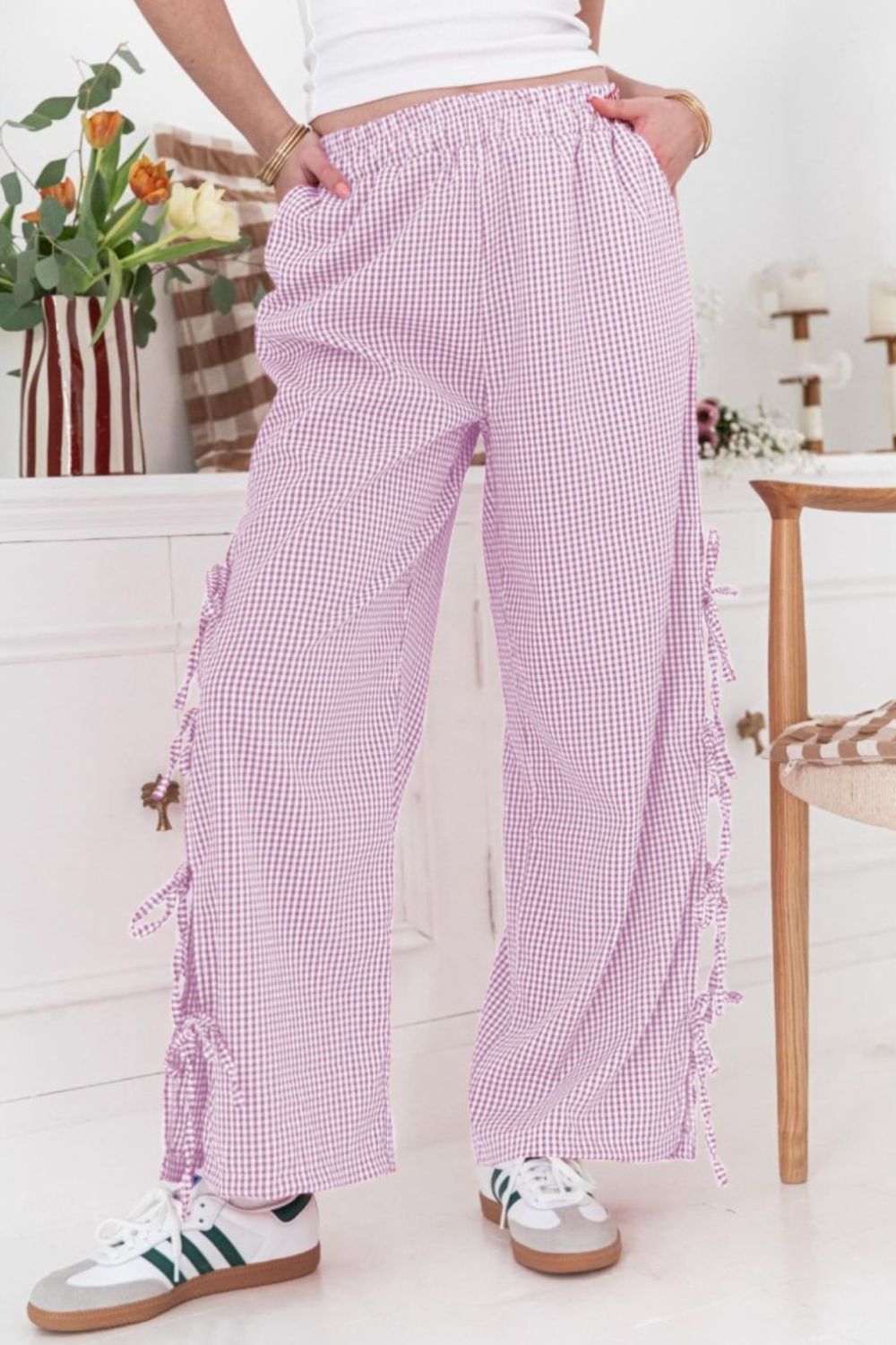 Gingham palazzo trousers in pink purple with side tie details and a wide leg.