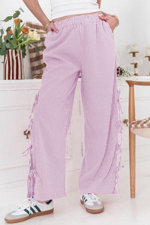 Gingham palazzo trousers in pink purple with side tie details and a wide leg.