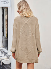 Khaki cable knit longline cardigan with diamond pattern detail on back.