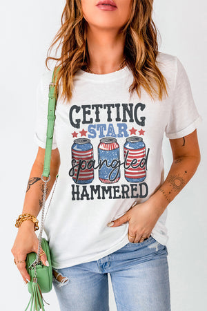 White graphic t-shirt with American flag beer cans and text.