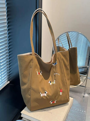 Brown shoulder bag with embroidered dachshunds and "fun fun party" text