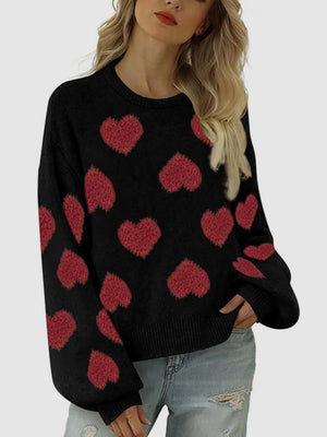 Black acrylic blend sweater with red heart motif and balloon sleeves.