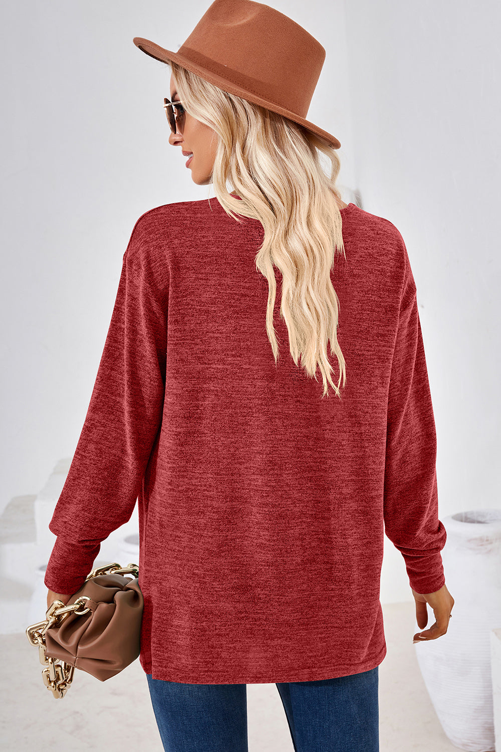 Relaxed V-neck tunic top in rust heather with long sleeves and a casual fit.