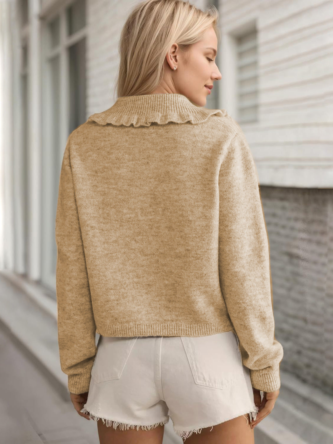 Tan knit cardigan with frilled collar and button front detail.