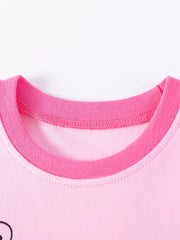 Children's pink short sleeve top with contrast pink neckline and ladybug graphic detail.