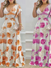 Maxi dress with V-neck, ruffle sleeves, and floral print in pumpkin or fuchsia pink.