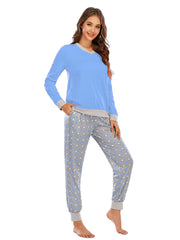 Pastel blue long sleeve lounge set with grey trim and polka dot pants.