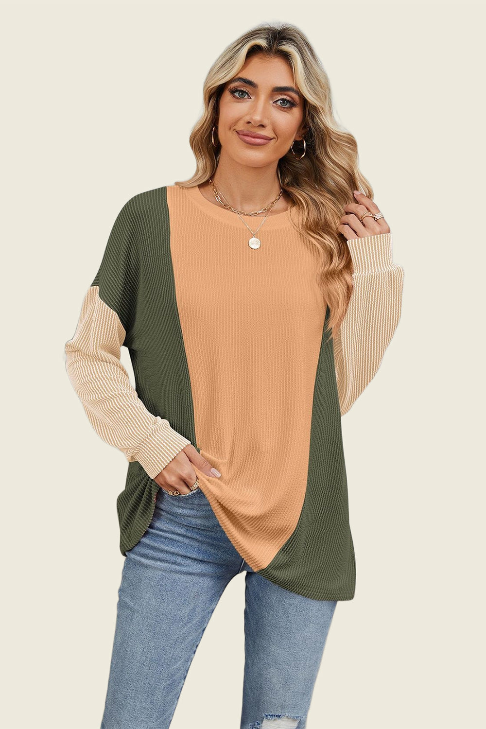 Colorblock waffle knit pullover with crew neck and long sleeves in tan, moss green, and cream.