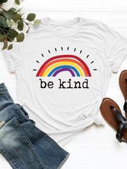 White crew neck t-shirt with a rainbow graphic and "be kind" text.