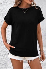 Black vertical ribbed tee with split hem and cuffed short sleeves.