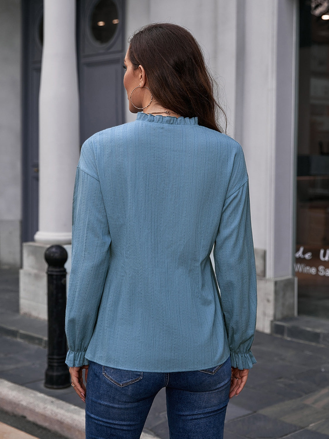 Dusty blue textured blouse with ruffle collar and cuffs