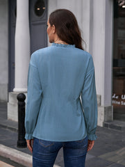 Dusty blue textured blouse with ruffle collar and cuffs