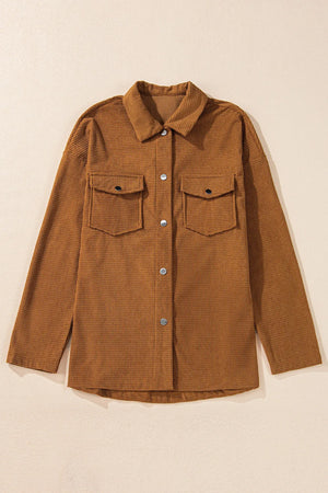 Brown waffle knit overshirt with button-down front and two patch pockets.