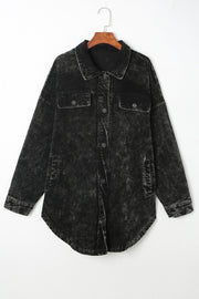 Black textured corduroy overshirt with faded wash, button front and chest pockets.