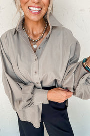 Light gray balloon sleeve button-down blouse with a relaxed fit and button cuffs.