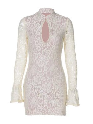 White lace cutout mini dress with flared sleeves and mock neck.