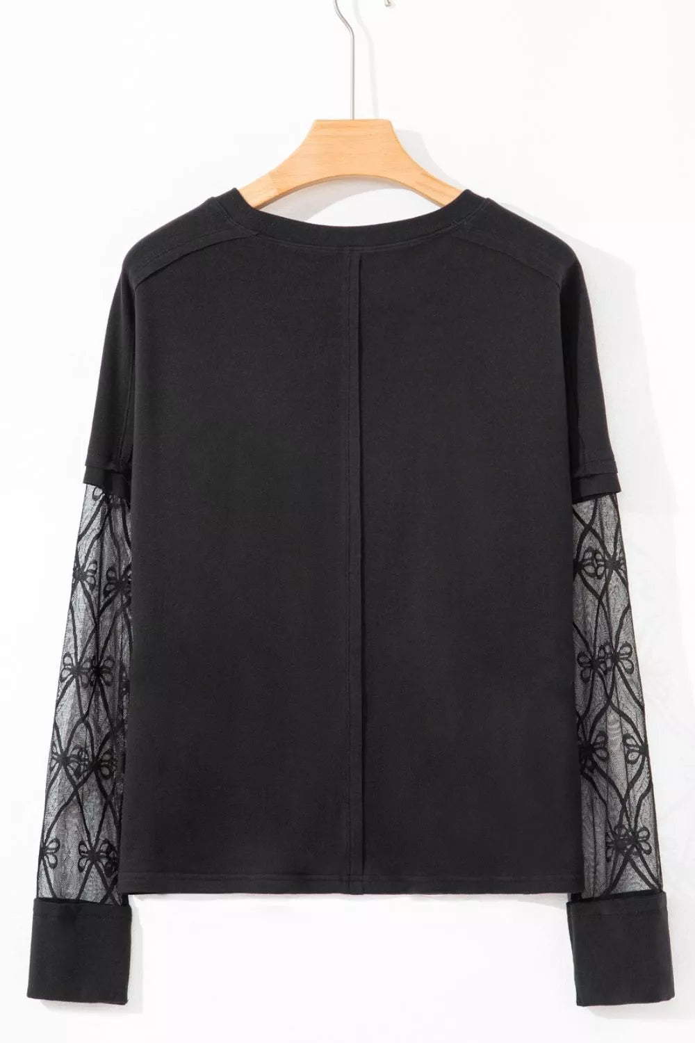 Black maternity t-shirt with lace-embellished sleeves and crew neck.