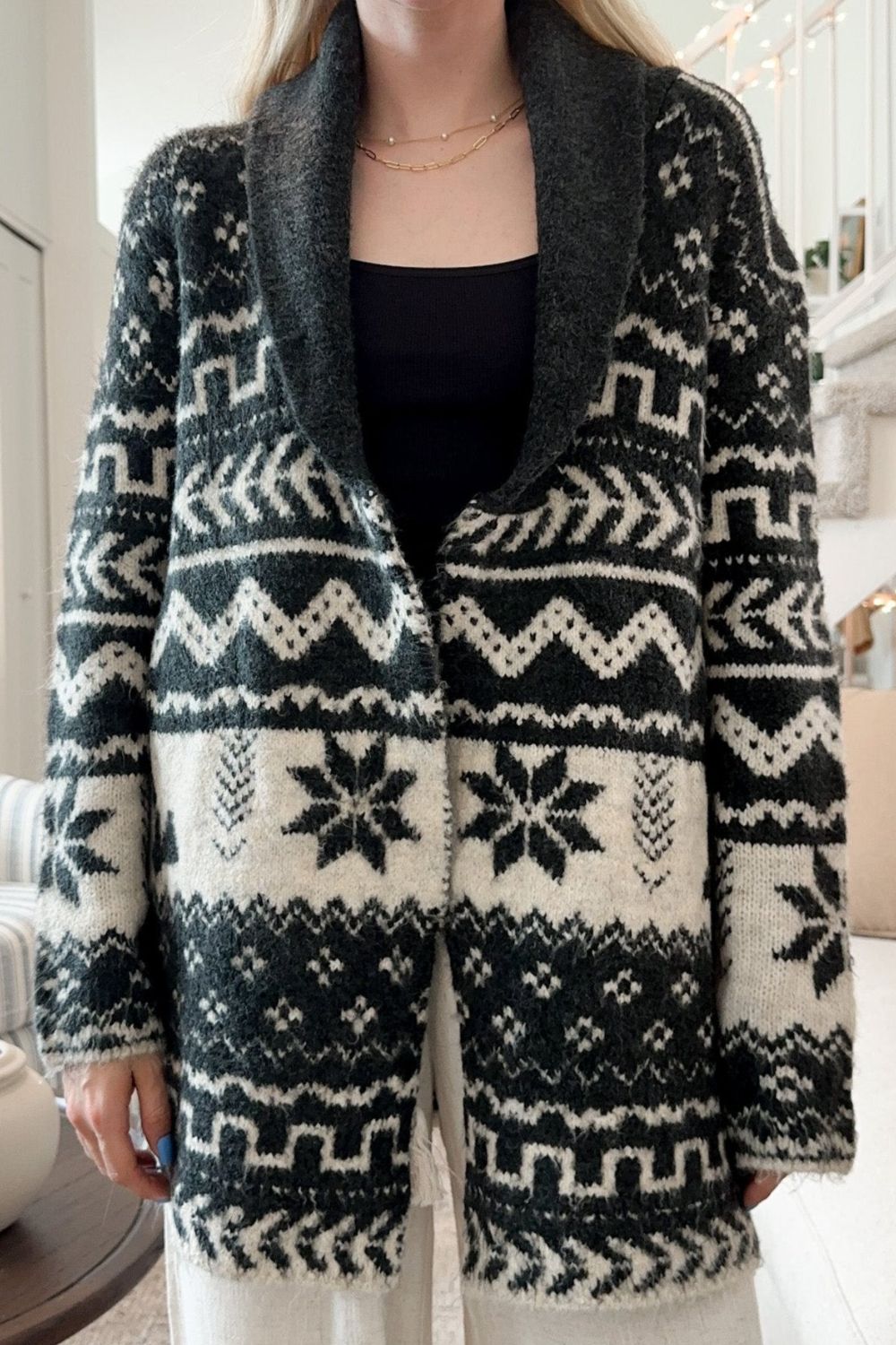 Black geometric jacquard knit cardigan with shawl collar and snowflake pattern