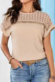 Beige waffle knit top with short sleeves and a detailed lace yoke and neckline.