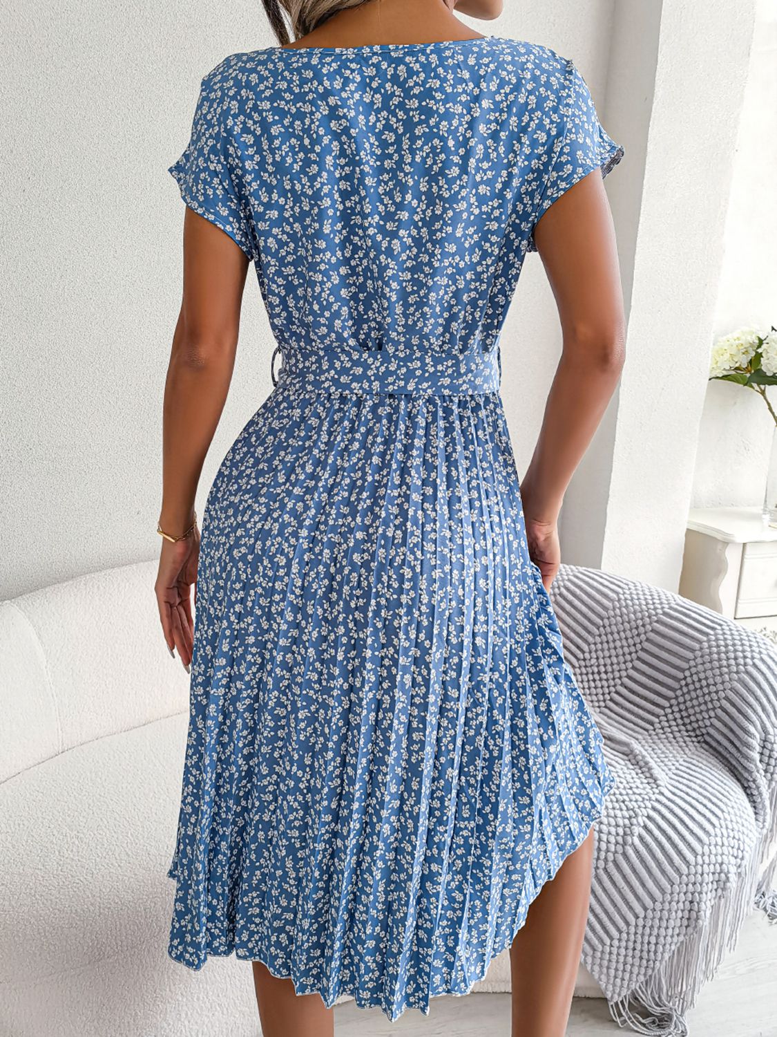 Sky blue floral print midi dress with tie waist and pleated skirt