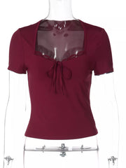 Wine red lace-trimmed tie-front t-shirt with square neckline and short sleeves.