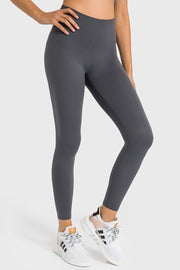 Gray high-waist performance leggings with a sculpted fit and ankle length.