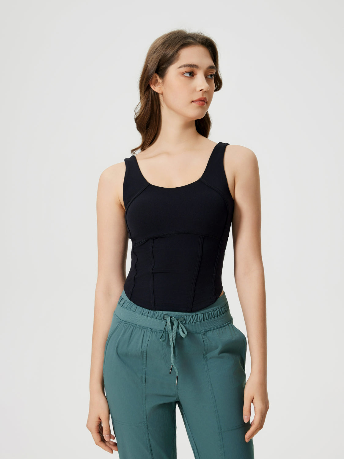 Black sculpted seam tank top with built-in support and scoop neckline.