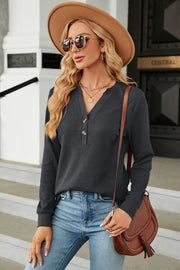 Dark Gray waffle knit henley top with button detail, long sleeves, and V-neck.