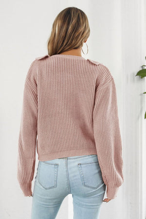 Dusty pink acrylic knit cardigan with ruffled collar detail, long sleeves, and ribbed texture.