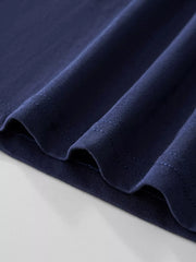 Dark navy cotton tee showing fabric texture and stitching detail.