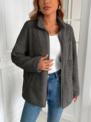 Dark gray teddy fleece jacket with zip front and patch pocket detail.