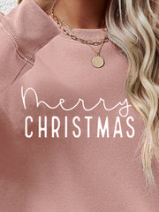 Blush pink crewneck sweatshirt with white Merry Christmas graphic, casual style.