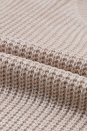 Textured knit sweater in tan acrylic with a subtle diamond pattern detail.