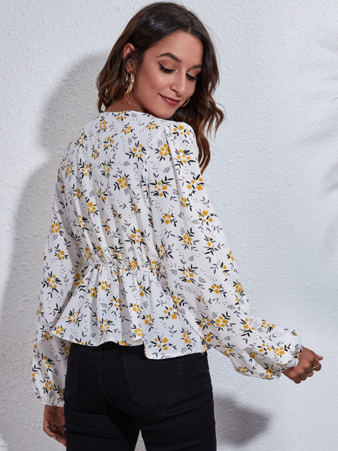 White floral peplum blouse with gathered waist and balloon sleeves