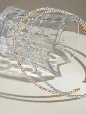 Diamond row collar necklaces in gold and silver with sparkling stones.