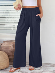 Pleated palazzo trousers in dark blue with pockets and a wide leg