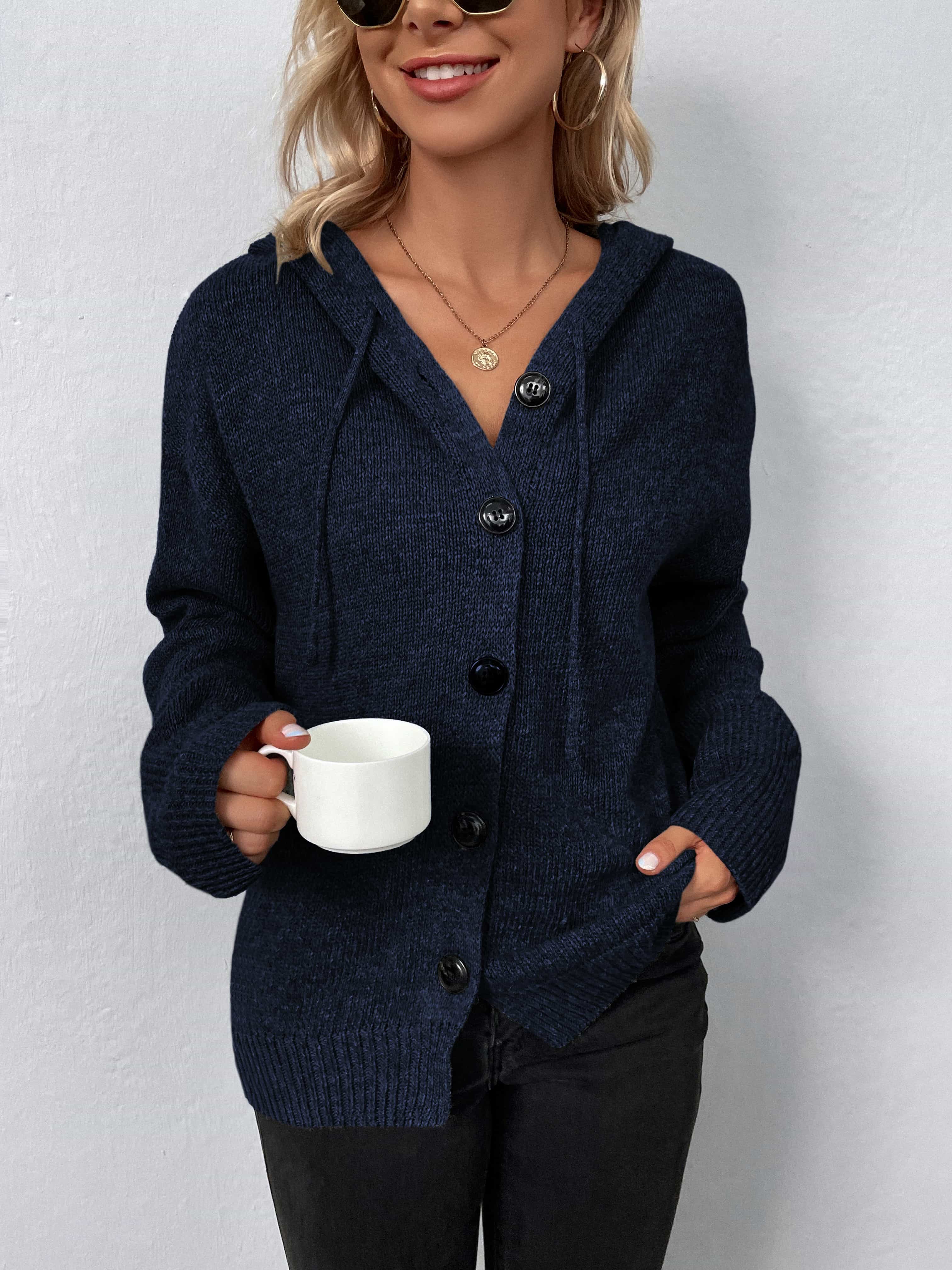Dark blue button-front hooded knit cardigan with drawstring and black buttons.