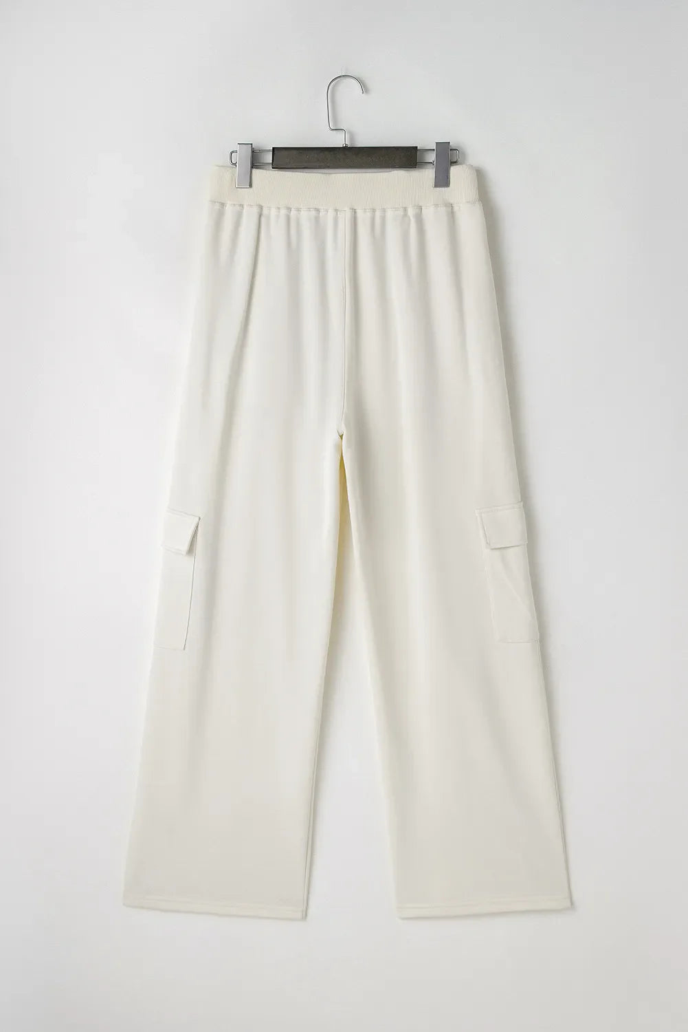 Ivory wide leg cargo pants with elastic waistband and patch pockets.