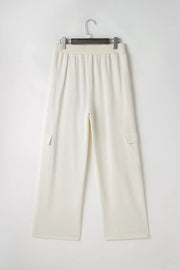 Ivory wide leg cargo pants with elastic waistband and patch pockets.