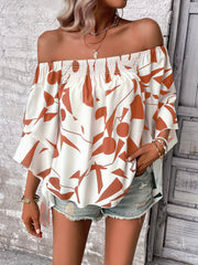 Off-shoulder white blouse with geometric print and flared sleeves