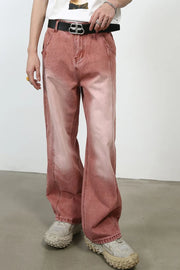 Relaxed fit coral denim jeans with a faded wash and wide leg