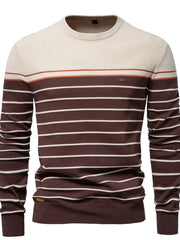 Crewneck sweater with horizontal stripes in brown, ivory, and orange.