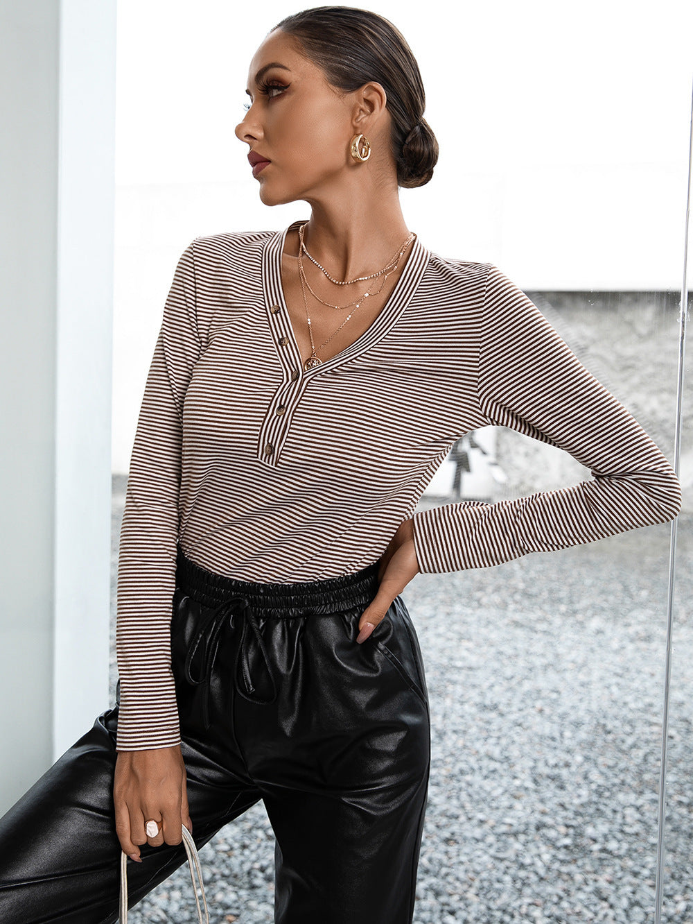 Ribbed henley stripe top with button detail and long sleeves.