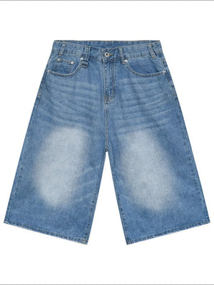 Light blue denim culottes with a wide leg and distressed detailing.