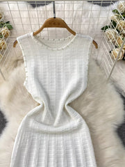 White knit midi dress with pearl trim and cutout details