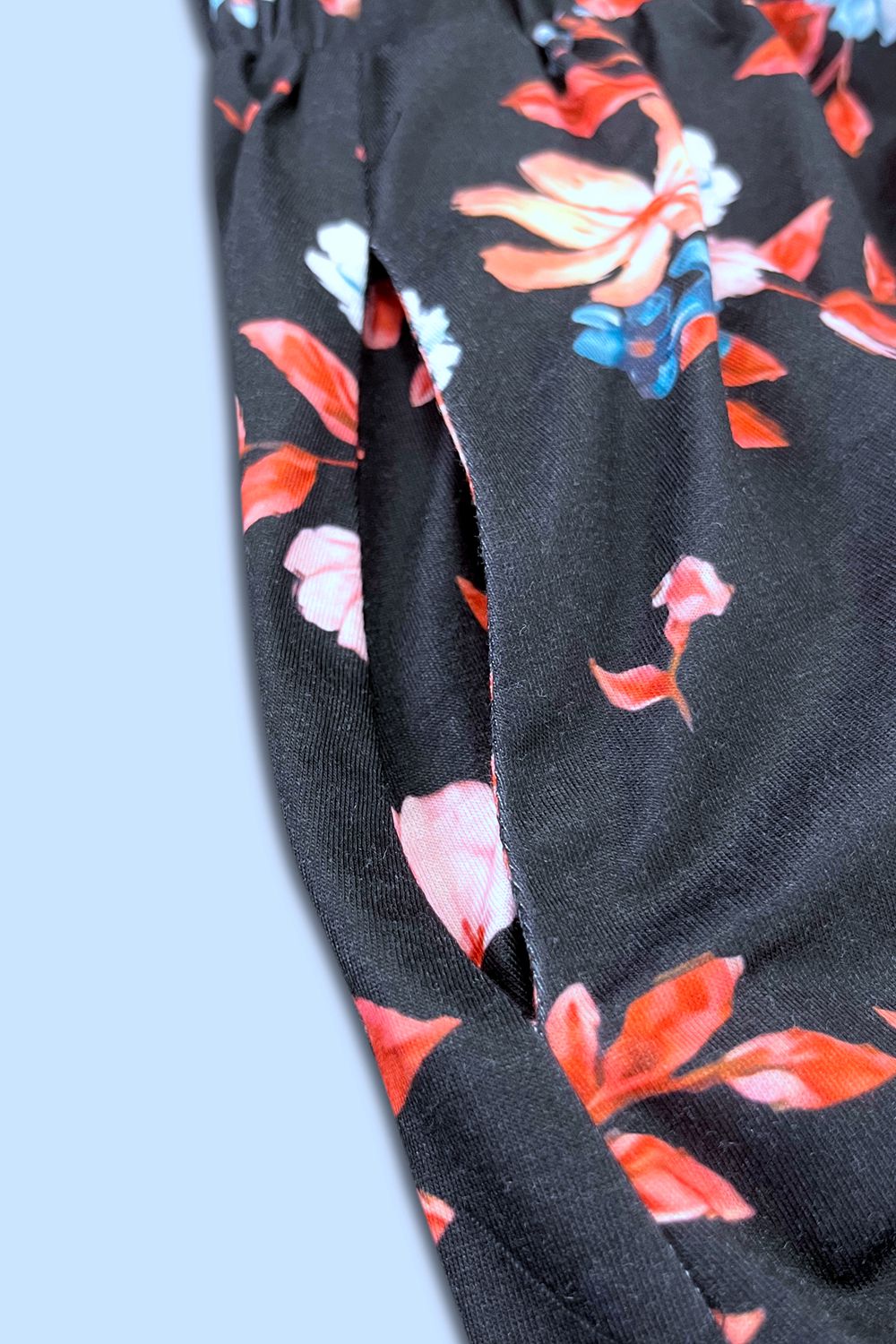 Black floral print sleeveless midi dress with side pocket detail