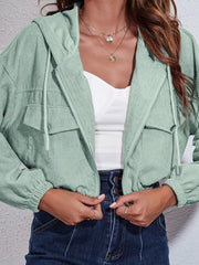Light green corduroy hooded jacket with zip front and chest pockets.
