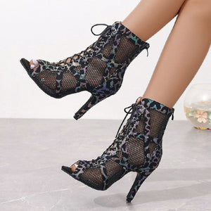 Black lace-up peep-toe ankle booties with animal print mesh and stiletto heel.