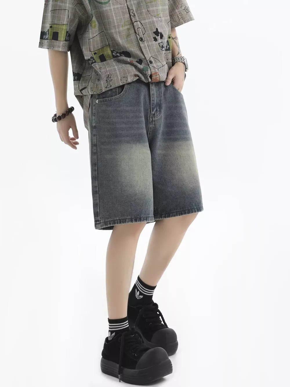 Men's relaxed fit denim shorts in vintage wash blue with faded details.